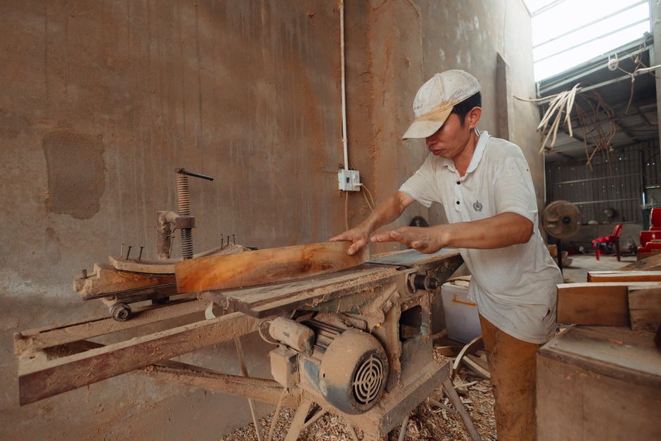 Master carpenter working on handmade furniture in the woodshop